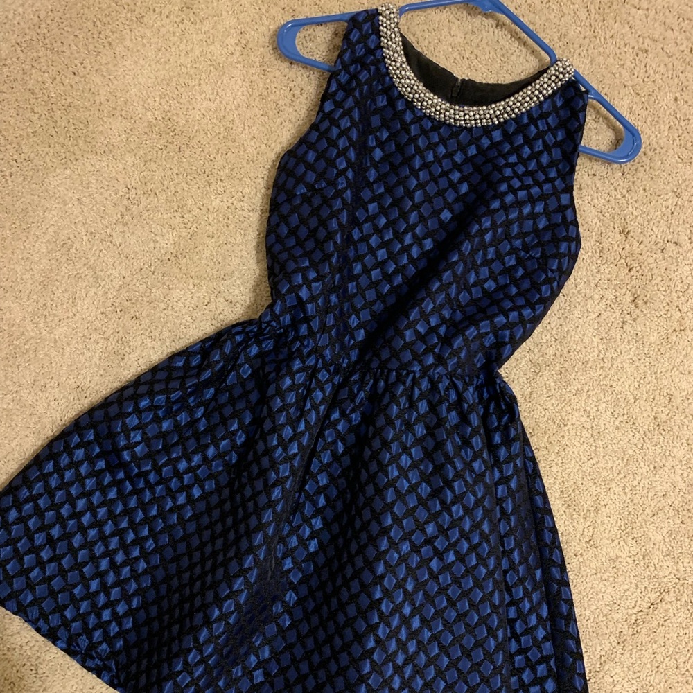 Navy blue doll dress with metal designed neckline,